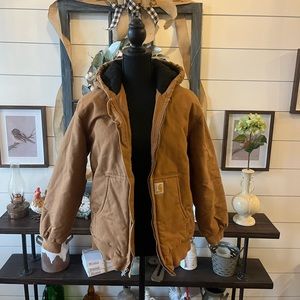 A Carhartt jacket, size Large kids, color tan